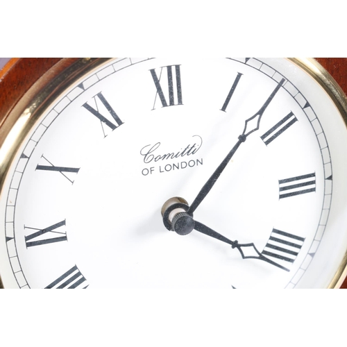 19 - Comitti of London mahogany cased tulip mantel clock, 26cm high.