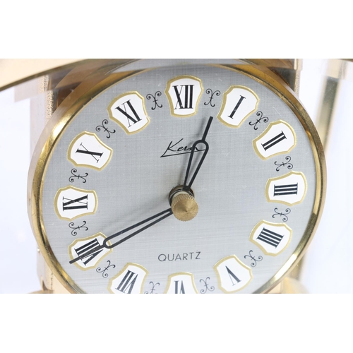 22 - Kern of West Germany brass and four glass anniversary clock of tapering form, 16cm high.