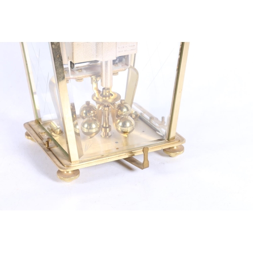 22 - Kern of West Germany brass and four glass anniversary clock of tapering form, 16cm high.