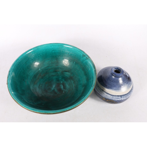 225 - Teal ground bowl, with brass rim, 22cm diameter, and a Far North Studio Pottery vase.  (2)