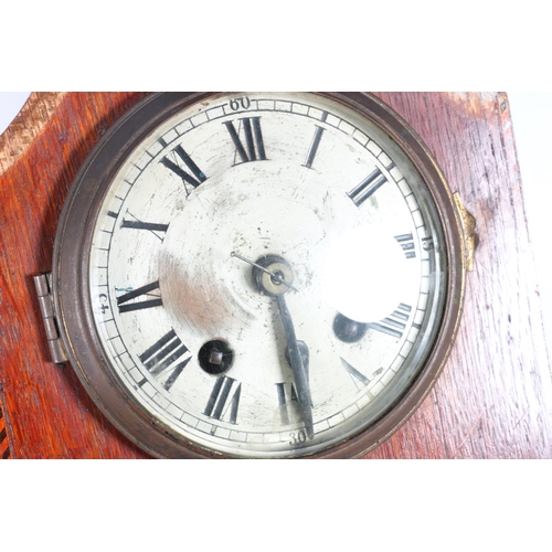 24 - Oak cased mantel clock, 28cm high.