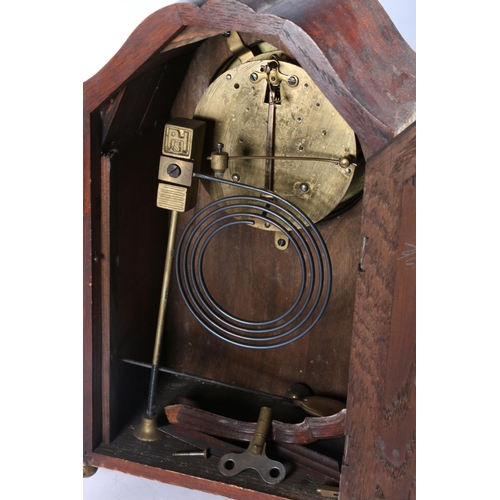 24 - Oak cased mantel clock, 28cm high.