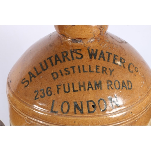 38 - Salutaris Water Co. Distillery stoneware flagon, 33cm high, and two stoneware storage crocks.