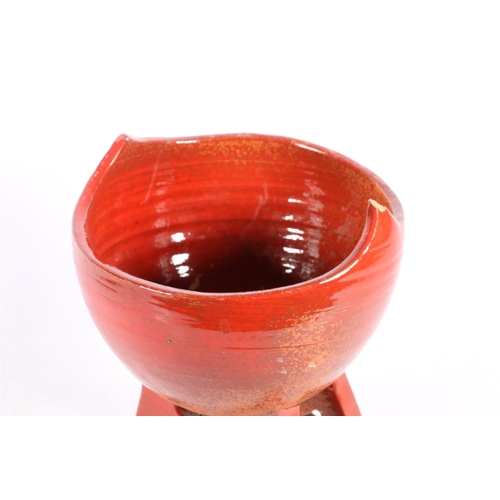 58 - Red glazed abstract Studio Pottery jar and cover, 32cm.  (a/f)