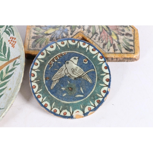 73 - Studio Pottery wall plate, decorated with deer surrounded by foliage, along with two Iznik style gla... 