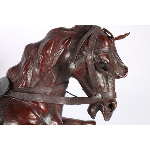 8 - Leather covered model of a horse, 43cm long.