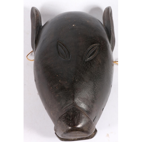 9 - Carved African mask of an animal head, 32cm.