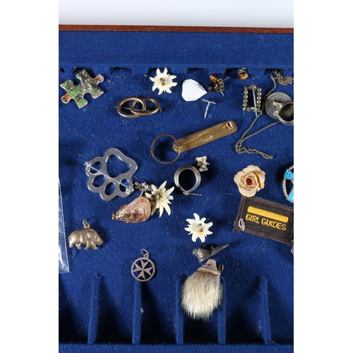 462 - Costume jewellery and charms, some silver, in mahogany canteen.