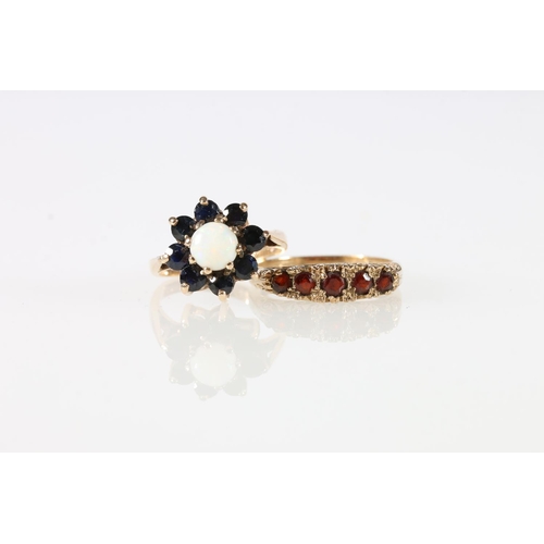 480 - 9k gold cluster ring with opal cabochon encircled by eight dark blue stones, size K, and a 9k g... 