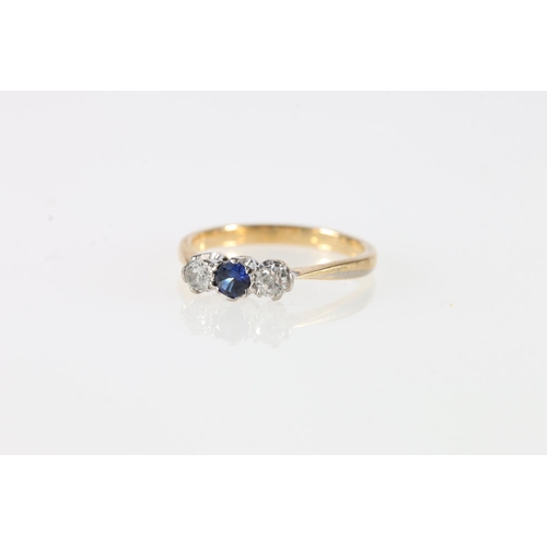 555 - 18ct gold sapphire and diamond three-stone ring, 2.59g.