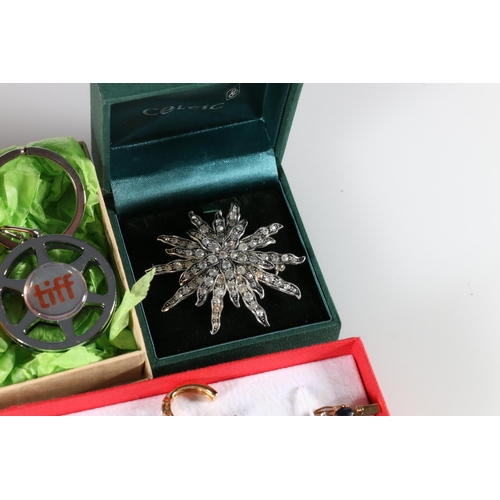 560 - Costume jewellery to include Movitex brooch, floral brooches, a Cameo style brooch, a plated bracele... 