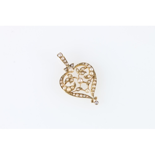 566 - Edwardian 9ct gold and seed pearl heart shaped pendant, 4.4g.