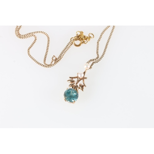 569 - 9ct gold mounted pearl and faceted blue stone pendant by C & F on an unhallmarked fixed chain, 5... 