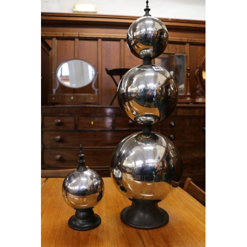 146 - Modern sculpture made from three graduated chromed spheres, and other single similar sphere, largest... 