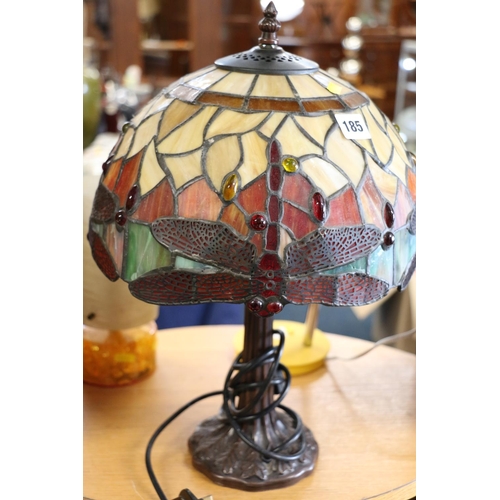 185 - Tiffany style table lamp, with leaded glass shade, decorated with a dragonfly, 43cm high.