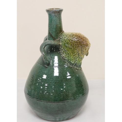 467 - Studio pottery bottle vase with owl mask head, twin scroll handles and green and brown glazes, unmar... 