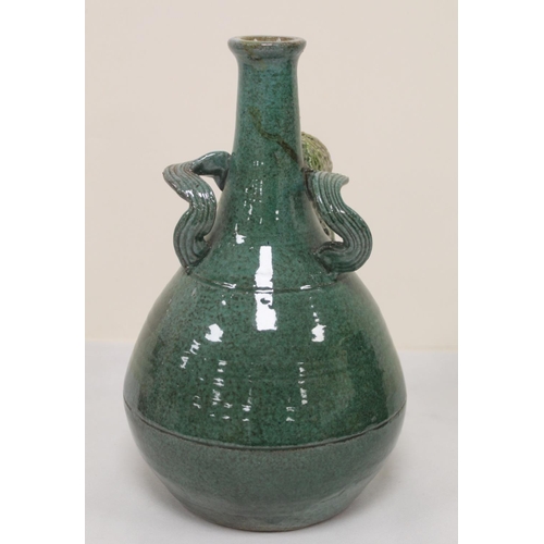 467 - Studio pottery bottle vase with owl mask head, twin scroll handles and green and brown glazes, unmar... 