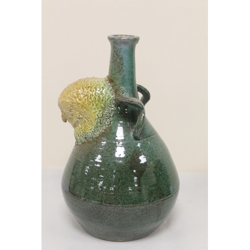 467 - Studio pottery bottle vase with owl mask head, twin scroll handles and green and brown glazes, unmar... 