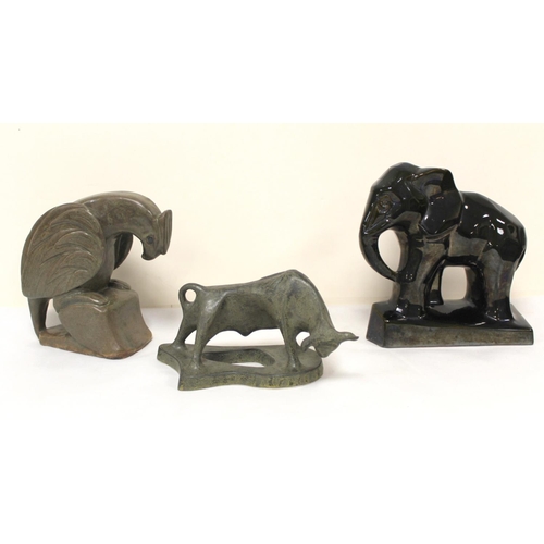 468 - Three Art Deco style pottery figures of a bull, 12cm high; an eagle, 19cm high and an elephant, 21cm... 