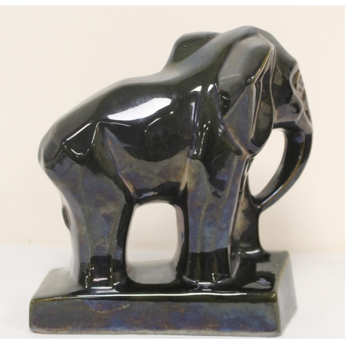 468 - Three Art Deco style pottery figures of a bull, 12cm high; an eagle, 19cm high and an elephant, 21cm... 