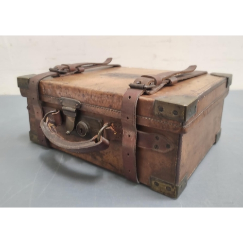 542 - Angling. Early 20th century leather and brass bound fly reservoir of trunk form, the hinged lid embo... 