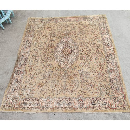 504 - Machine woven Eastern carpet with central lozenge and foliate scrolls in creams and browns, 355cm x ... 