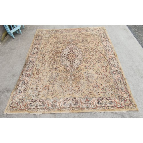 504 - Machine woven Eastern carpet with central lozenge and foliate scrolls in creams and browns, 355cm x ... 