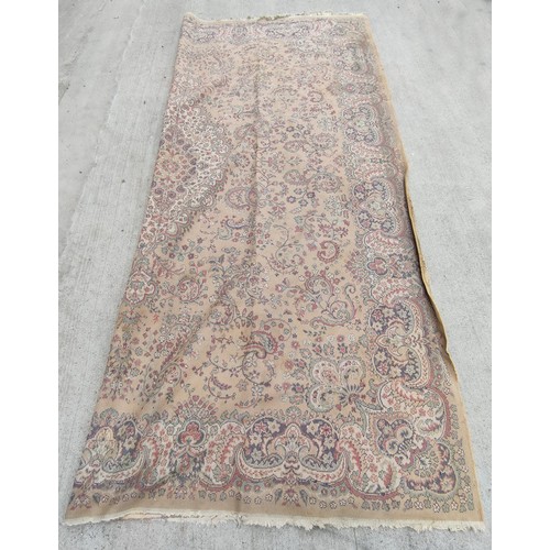 504 - Machine woven Eastern carpet with central lozenge and foliate scrolls in creams and browns, 355cm x ... 