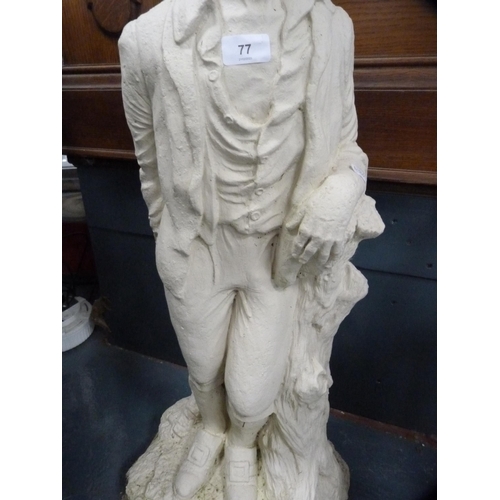 174 - Plaster figure of a male on a naturalistic setting.