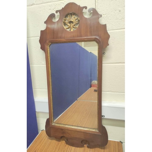 605 - George III mahogany scroll wall mirror, with parcel gilt motif, 110cm high and 53cm wide. .