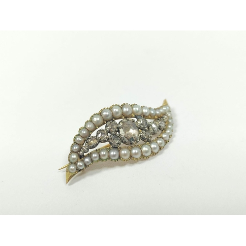 64A - Georgian gold and diamond brooch of waved pointed shape with nine rose diamonds and a border of pear... 