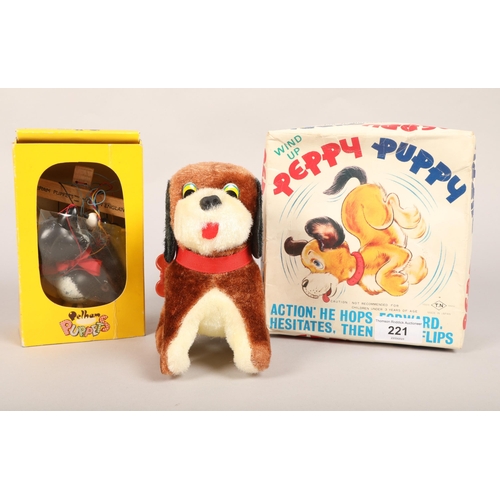 221 - Boxed Pelham Puppet Cat A8; together with a wind up Petty Puppy (2)