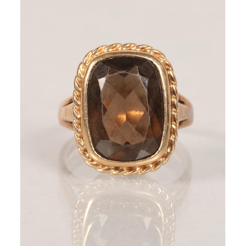 61 - 9 carat yellow gold and smoky quartz set ring; ring size Q; 6.6g gross weight