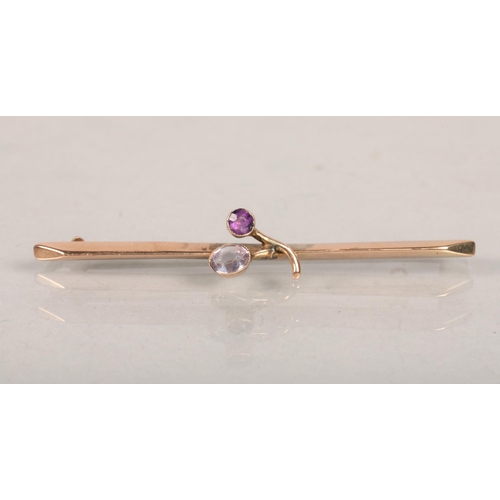 92 - 9 carat yellow gold and Amethyst set floral spray brooch; 1.7g gross weight 