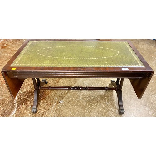 501 - Regency style mahogany and leather drop leaf coffee table; raised on outswept supports with brass li... 