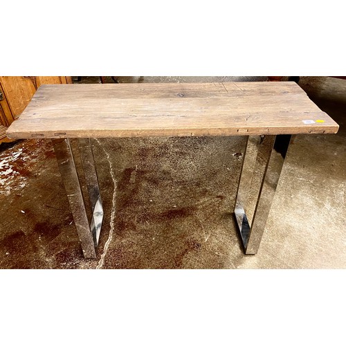 499 - Driftwood effect and chrome plated console style table; 109cm wide