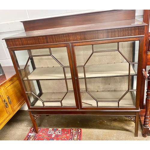 516 - Chippendale style mahogany twin door display cabinet; raised on square supports; 122cm wide