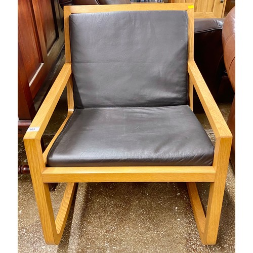 503 - Contemporary oak framed and leather low rocking chair