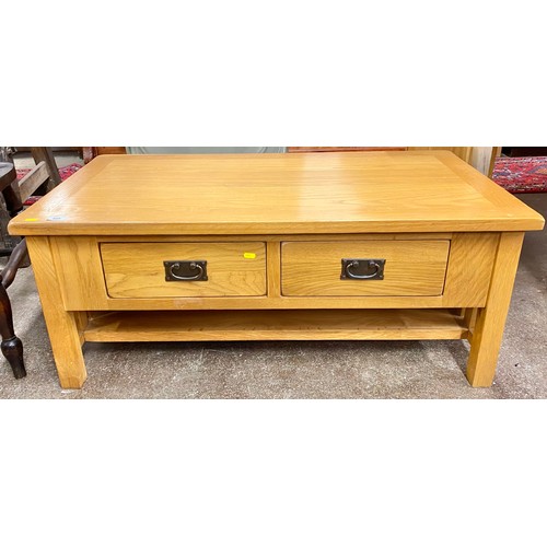 509 - Contemporary oak two drawer table; 110cm wode