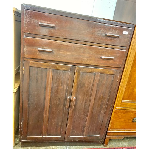 521 - 1930s mahogany two door and drawer cabinet; 125cm hig