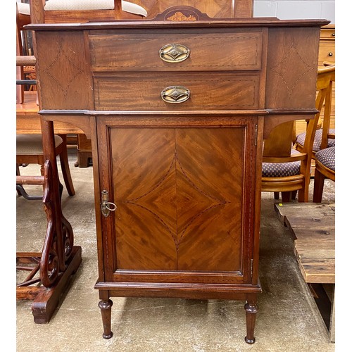 495 - Art Nouveau inlaid mahogany two drawer and single door cupboard; raised on turned supports; 88cm wid... 