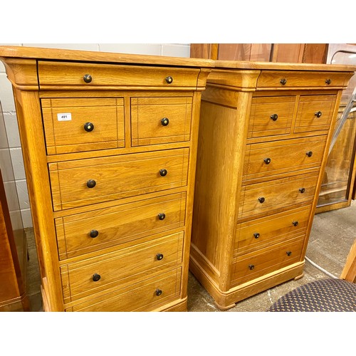 491 - Pair of contemporary oak two drawer over four drawer chest of drawers; raised on bracket feet; 121cm... 