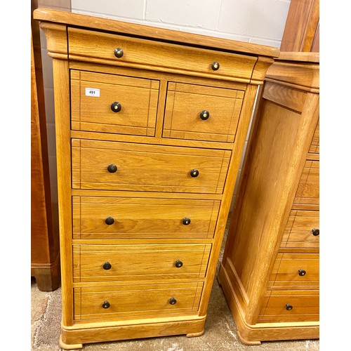 491 - Pair of contemporary oak two drawer over four drawer chest of drawers; raised on bracket feet; 121cm... 