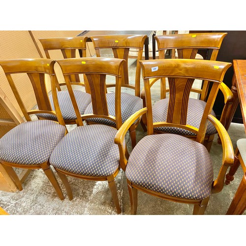 490 - Set of six walnut framed chairs; two carvers and four singles with stuff over seats