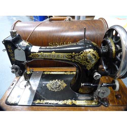 10 - Singer portable sewing machine in an oak case.