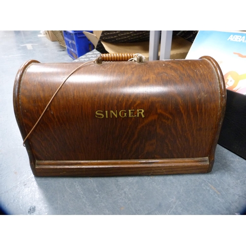 10 - Singer portable sewing machine in an oak case.