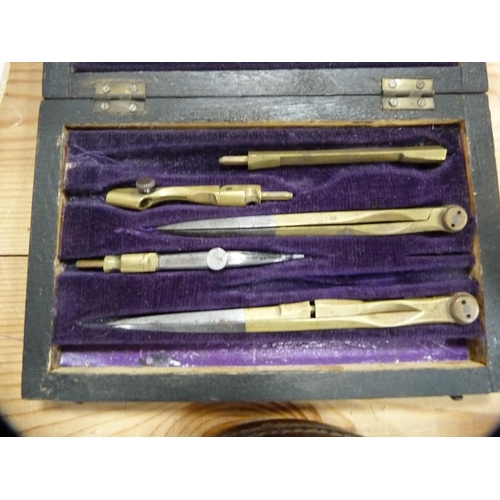 106 - Set of Victorian drawing instruments in a rosewood case and a tape measure.  (2)