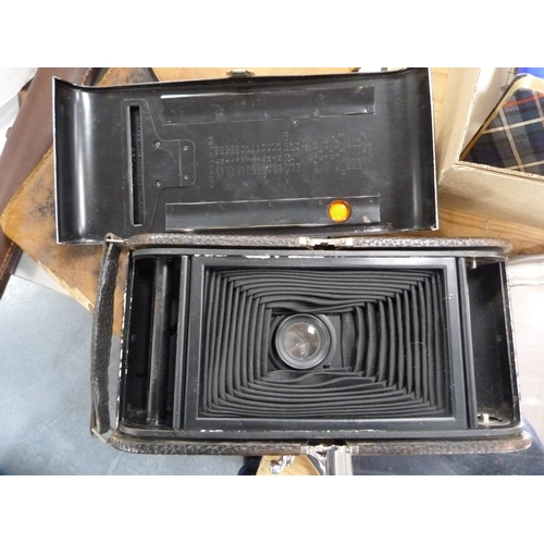 114 - Large Kodak folding camera with original case, pair of field glasses, tripod, Olympus Trip 35 camera... 