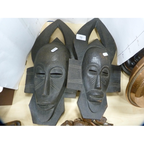 13 - Two similar tribal wooden wall masks, African-style ornaments and figures, and two elephant models.