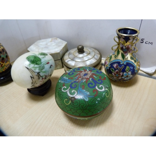 134 - Group of oriental cloisonné to include a small pair of Chinese-style vases on stands, eggs, miniatur... 